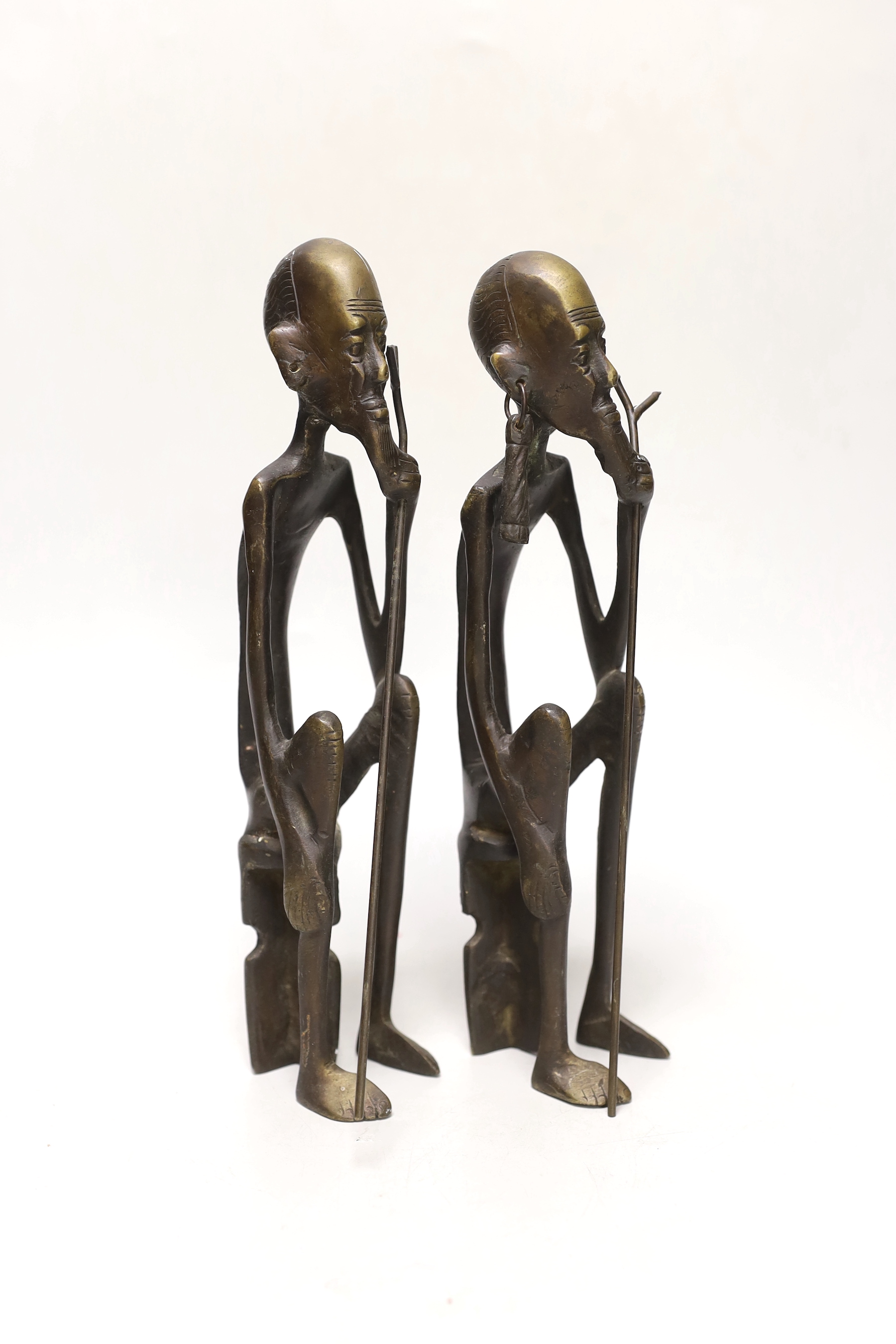 A pair of African figural bronzes, 27cm high